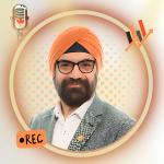 A bearded man wearing an orange turban and glasses looks straight into the camera. The picture is framed by an orange circle with icons for "Rec", a microphone with a Canadian flag, and a line graph going up.