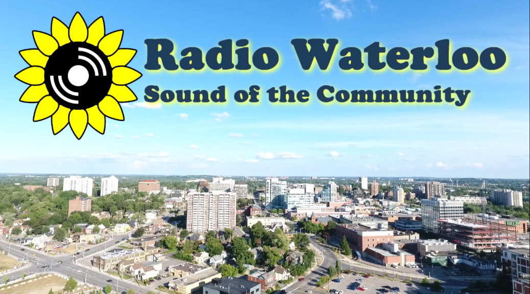 Radio Waterloo Sound of the Community (an aerial view of a cityscape (Kitchener), with the CKMS sunflower logo and text above the horizon against a blue sky with some fluffy white clouds)